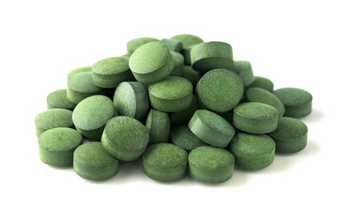 Таблетки из хлореллы (Chlorella vulgaris), фото фотография водоросли